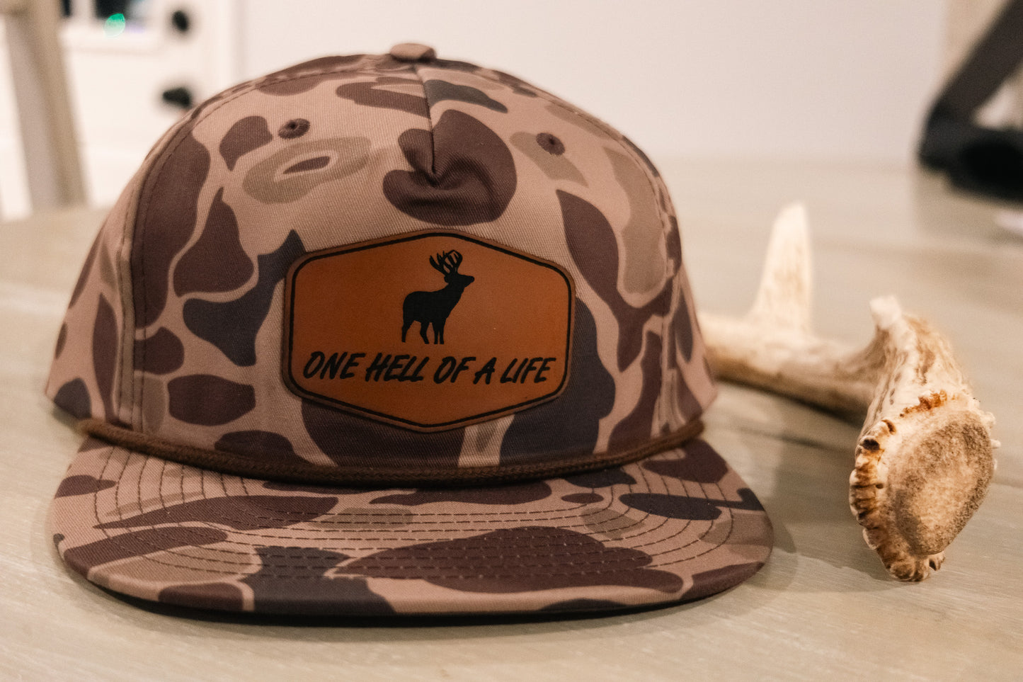 One Hell of a Life Old School Camo Buck Rope Hat x OHOAL Outdoor Podcast Coozie